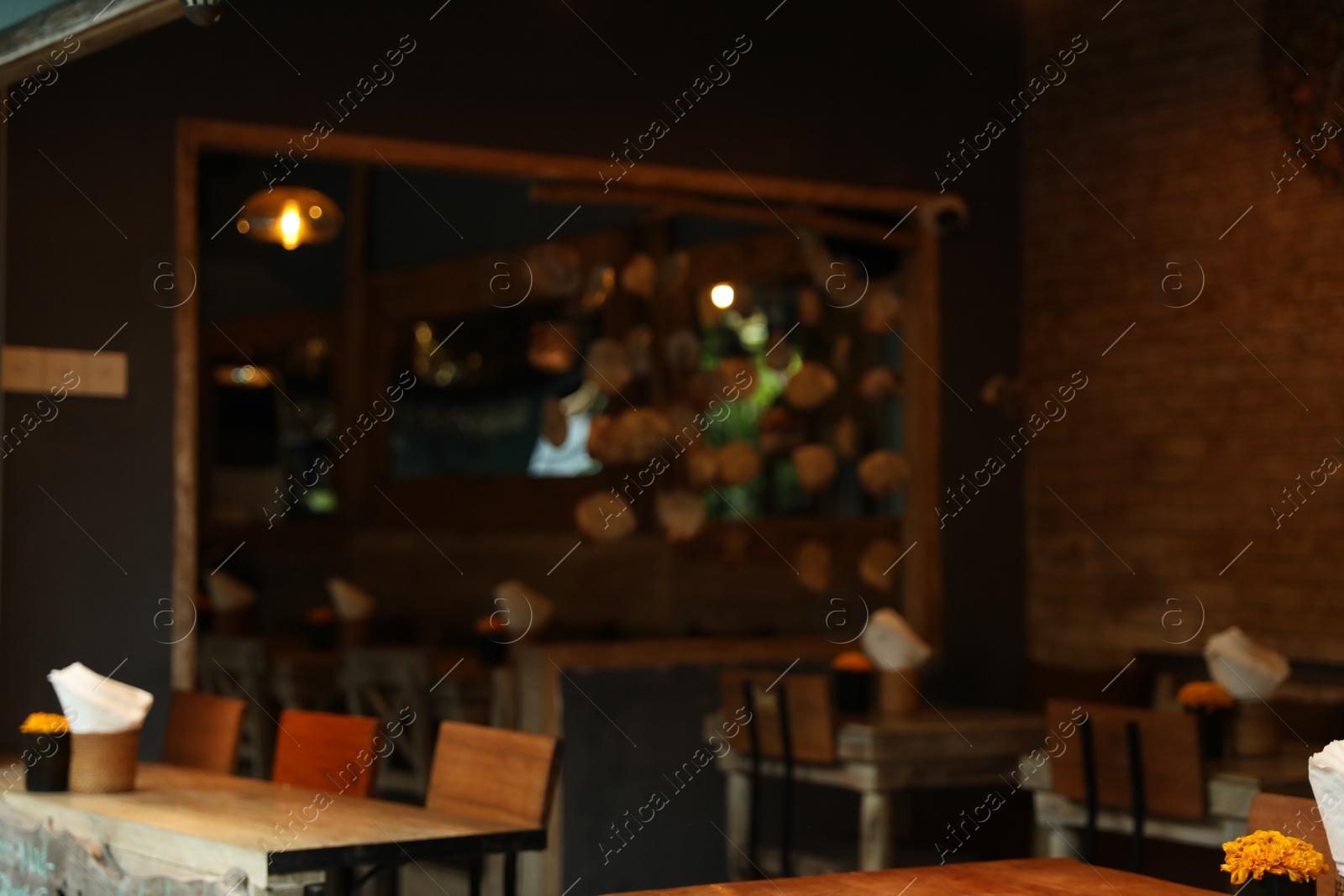 Blurred view of tables, chairs and decor in cozy cafe interior Photo of Blurred view of tables, chairs and decor in cozy cafe interior