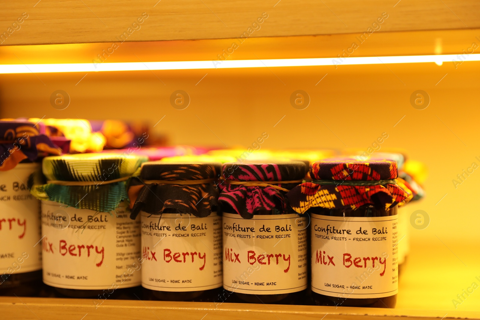 Bali, Indonesia - May 15, 2025: Different tasty jams in jars on shelf indoors, closeup Photo of Bali, Indonesia - May 15, 2025: Different tasty jams in jars on shelf indoors, closeup