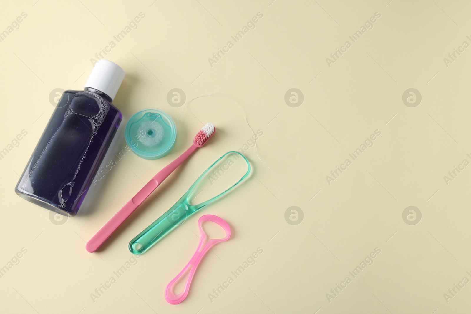 Photo of Different oral care products on beige background, flat lay. Space for text