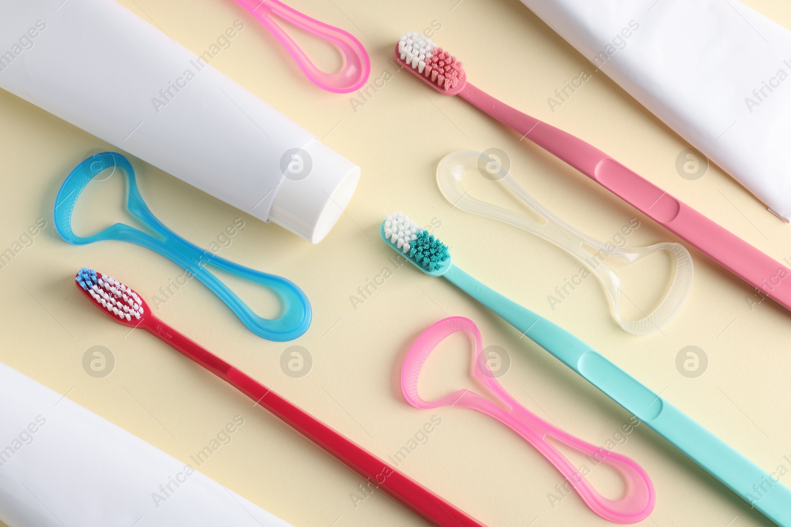 Different oral care products on beige background, flat lay Photo of Different oral care products on beige background, flat lay