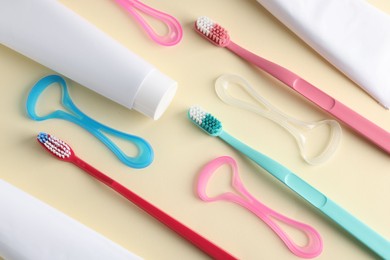 Photo of Different oral care products on beige background, flat lay