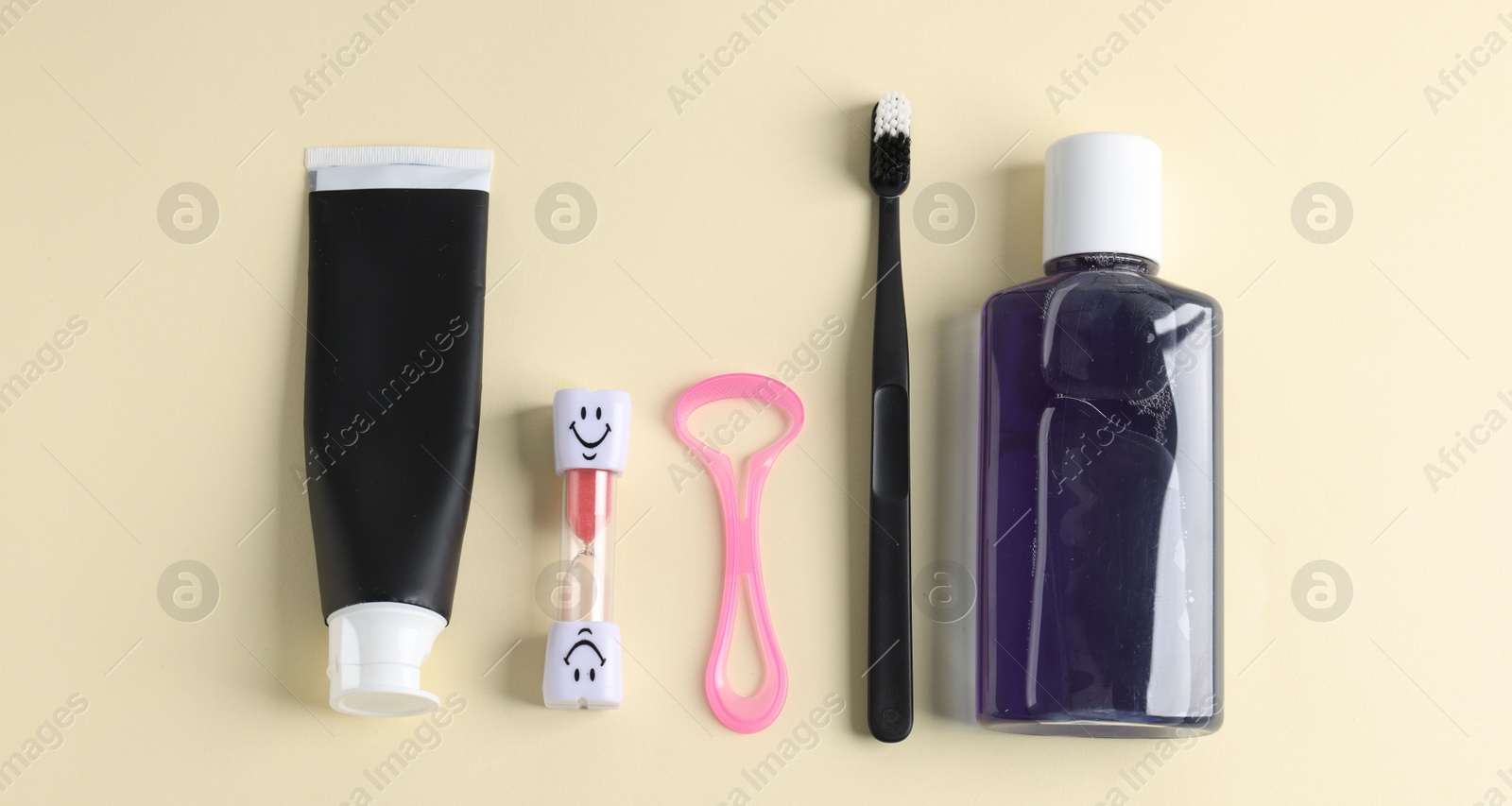 Different oral care products on beige background, flat lay Photo of Different oral care products on beige background, flat lay