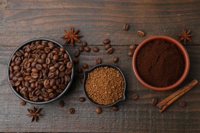 Photo of Different types of instant coffee, beans and spices on wooden table, flat lay