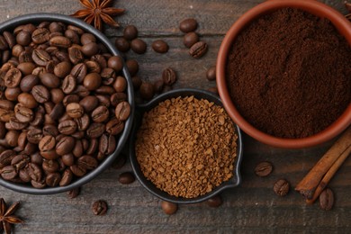 Photo of Different types of instant coffee, beans and spices on wooden table, flat lay