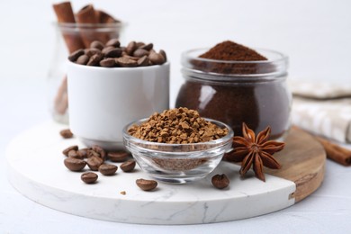 Photo of Different types of instant coffee, beans and spices on light table, closeup
