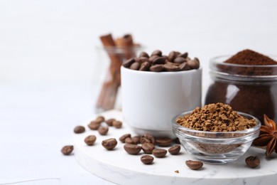 Photo of Different types of instant coffee, beans and spices on light textured table, closeup. Space for text