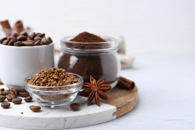Photo of Different types of instant coffee, beans and spices on light textured table, closeup. Space for text