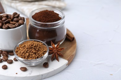Photo of Different types of instant coffee, beans and spices on light textured table, closeup. Space for text