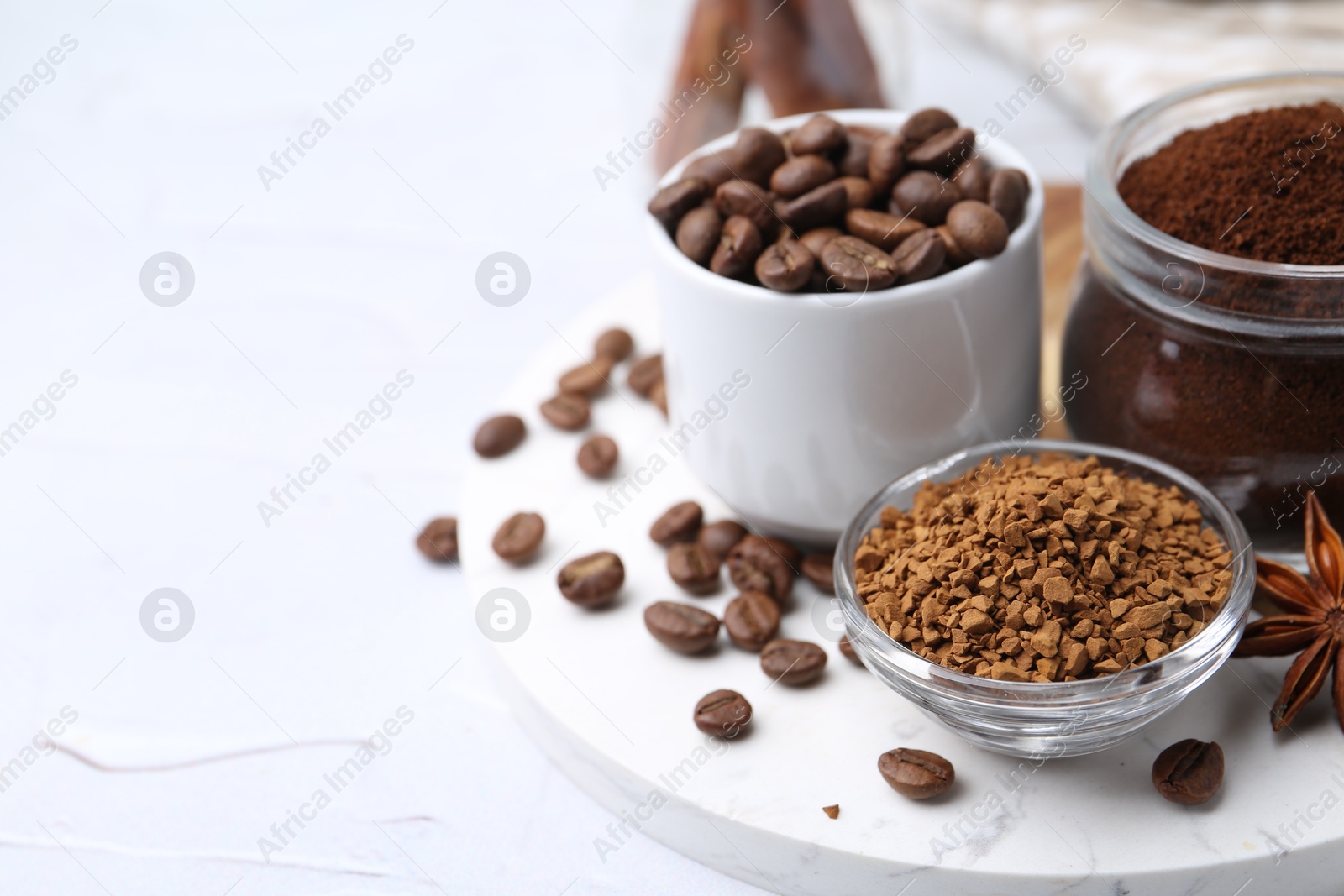 Different types of instant coffee, beans and spices on light textured table, closeup. Space for text Photo of Different types of instant coffee, beans and spices on light textured table, closeup. Space for text
