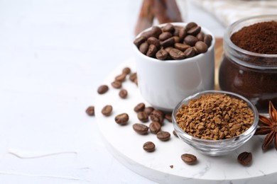 Photo of Different types of instant coffee, beans and spices on light textured table, closeup. Space for text