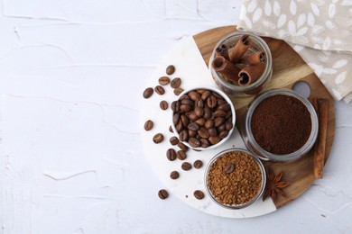 Photo of Different types of instant coffee, beans and spices on light textured table, top view. Space for text