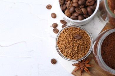 Photo of Different types of instant coffee, beans and spices on light textured table, top view. Space for text