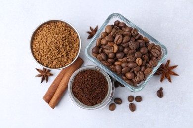 Photo of Different types of instant coffee, beans and spices on light table, flat lay