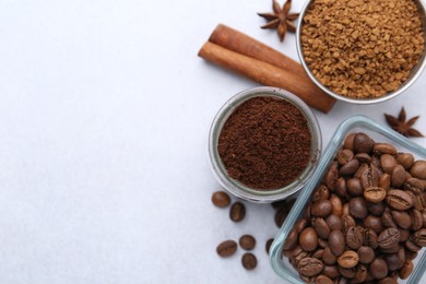 Photo of Different types of instant coffee, beans and spices on light table, flat lay. Space for text