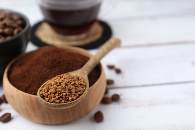 Photo of Different types of instant coffee and beans on white wooden table, closeup. Space for text