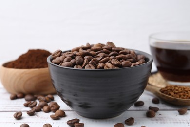 Photo of Roasted beans in bowl and different types of instant coffee on white wooden table, closeup