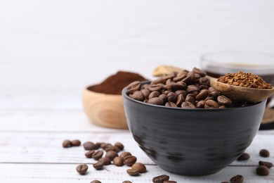 Photo of Roasted beans and granulated instant coffee on white wooden table, closeup. Space for text