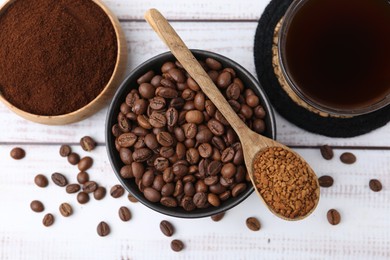 Photo of Different types of instant coffee, beans and aromatic drink on light wooden table, flat lay