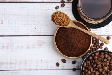 Photo of Different types of instant coffee, beans and aromatic drink on light wooden table, flat lay. Space for text