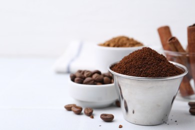 Photo of Instant coffee powder and beans on light table, selective focus. Space for text