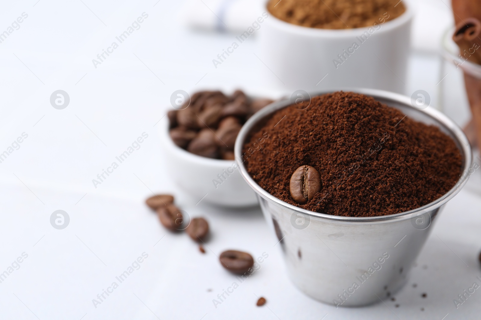 Instant coffee powder and beans on light table, selective focus. Space for text Photo of Instant coffee powder and beans on light table, selective focus. Space for text