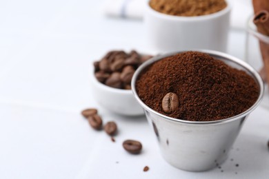 Photo of Instant coffee powder and beans on light table, selective focus. Space for text