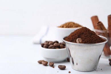 Photo of Instant coffee powder and beans on light table, selective focus. Space for text