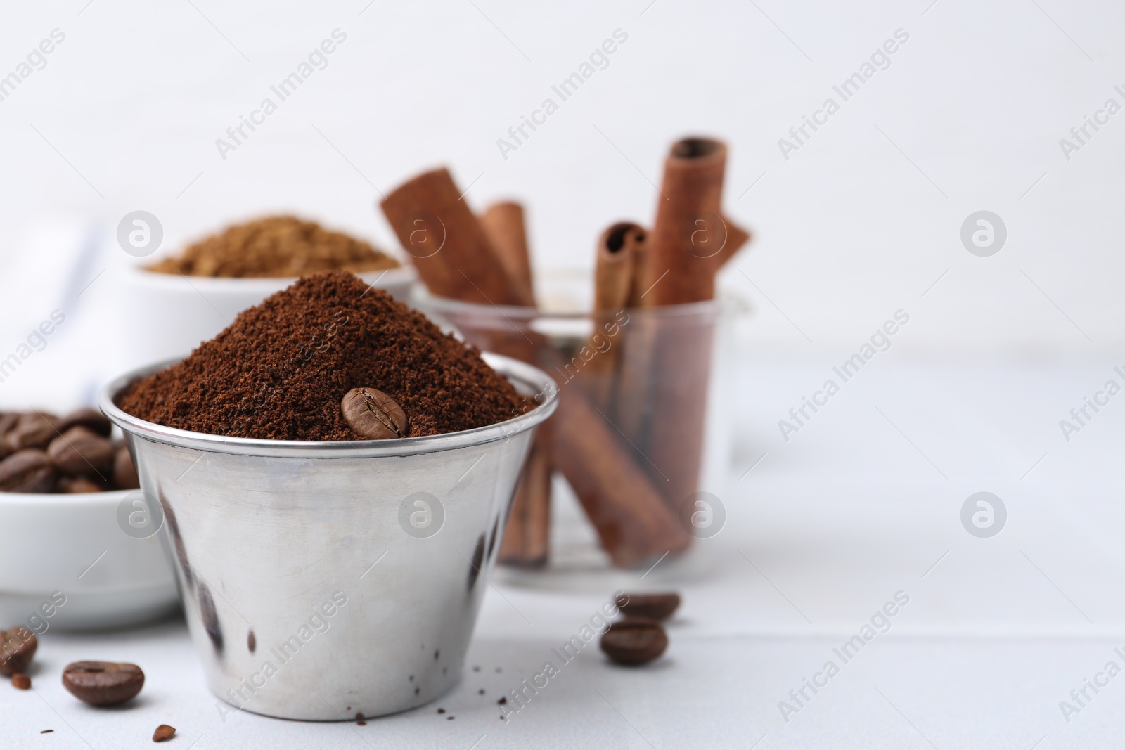 Instant coffee powder and beans on light table, selective focus. Space for text Photo of Instant coffee powder and beans on light table, selective focus. Space for text