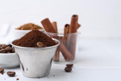 Photo of Instant coffee powder and beans on light table, selective focus. Space for text