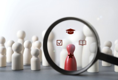 Image of Employee search. Red pawn among white ones, view through magnifying glass