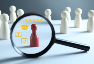 Image of Employee search. Red pawn among white ones, view through magnifying glass