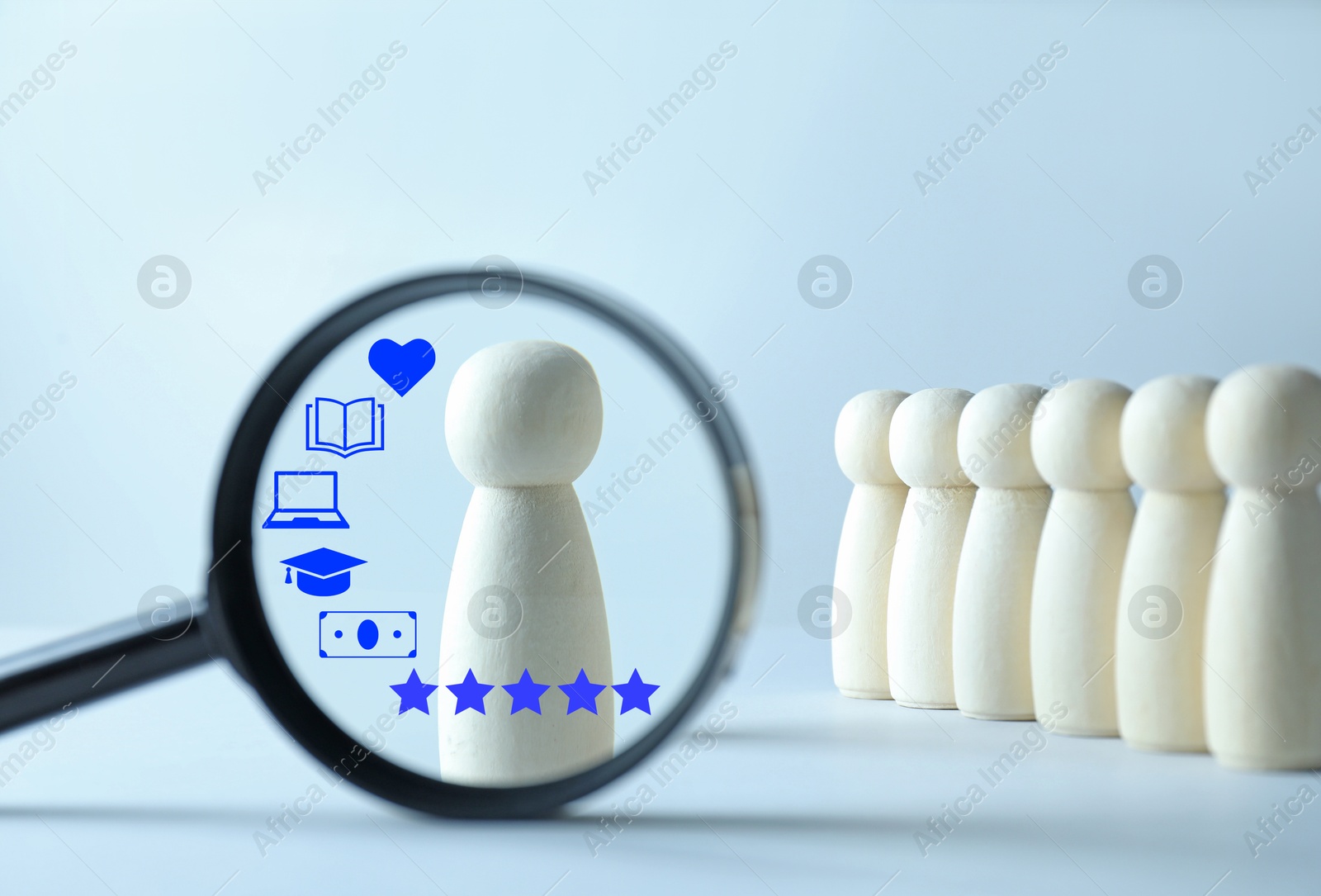Employee search. Pawn standing out, view through magnifying glass Image of Employee search. Pawn standing out, view through magnifying glass