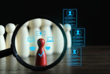 Image of Employee search. Red pawn among white ones on table, view through magnifying glass