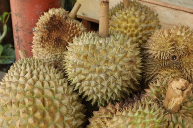 Photo of Fresh ripe durians at market, closeup view