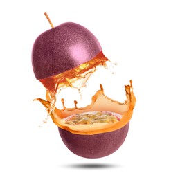 Image of Tasty passion juice splashing out from cut fruit in air on white background