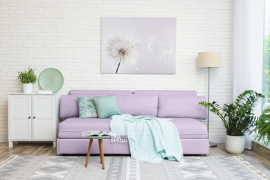 Image of Stylish living room with comfortable sofa and other furniture. Interior design