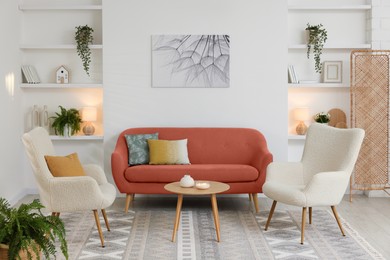 Image of Stylish living room with comfortable sofa and armchairs. Interior design