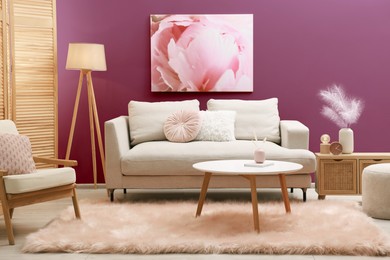 Image of Stylish living room with comfortable sofa and color wall. Interior design