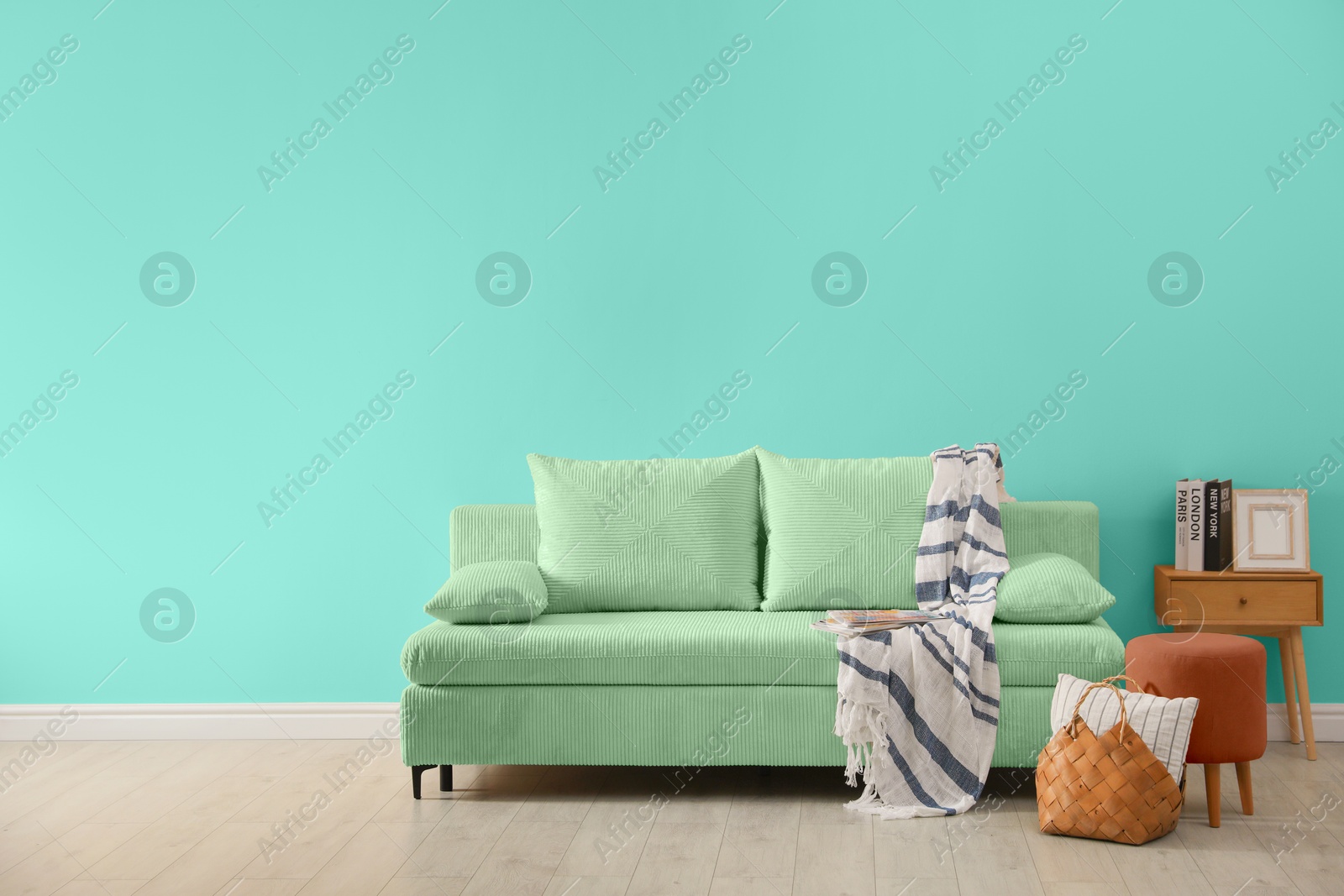 Stylish living room with comfortable sofa and turquoise wall. Interior design Image of Stylish living room with comfortable sofa and turquoise wall. Interior design