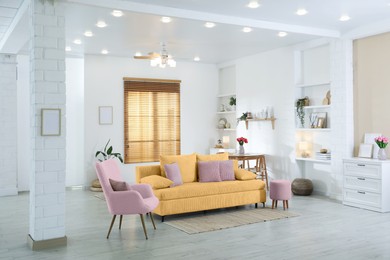 Image of Stylish living room with comfortable sofa and other furniture. Interior design