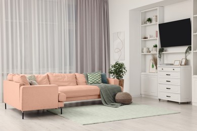 Image of Stylish living room with comfortable sofa near window. Interior design