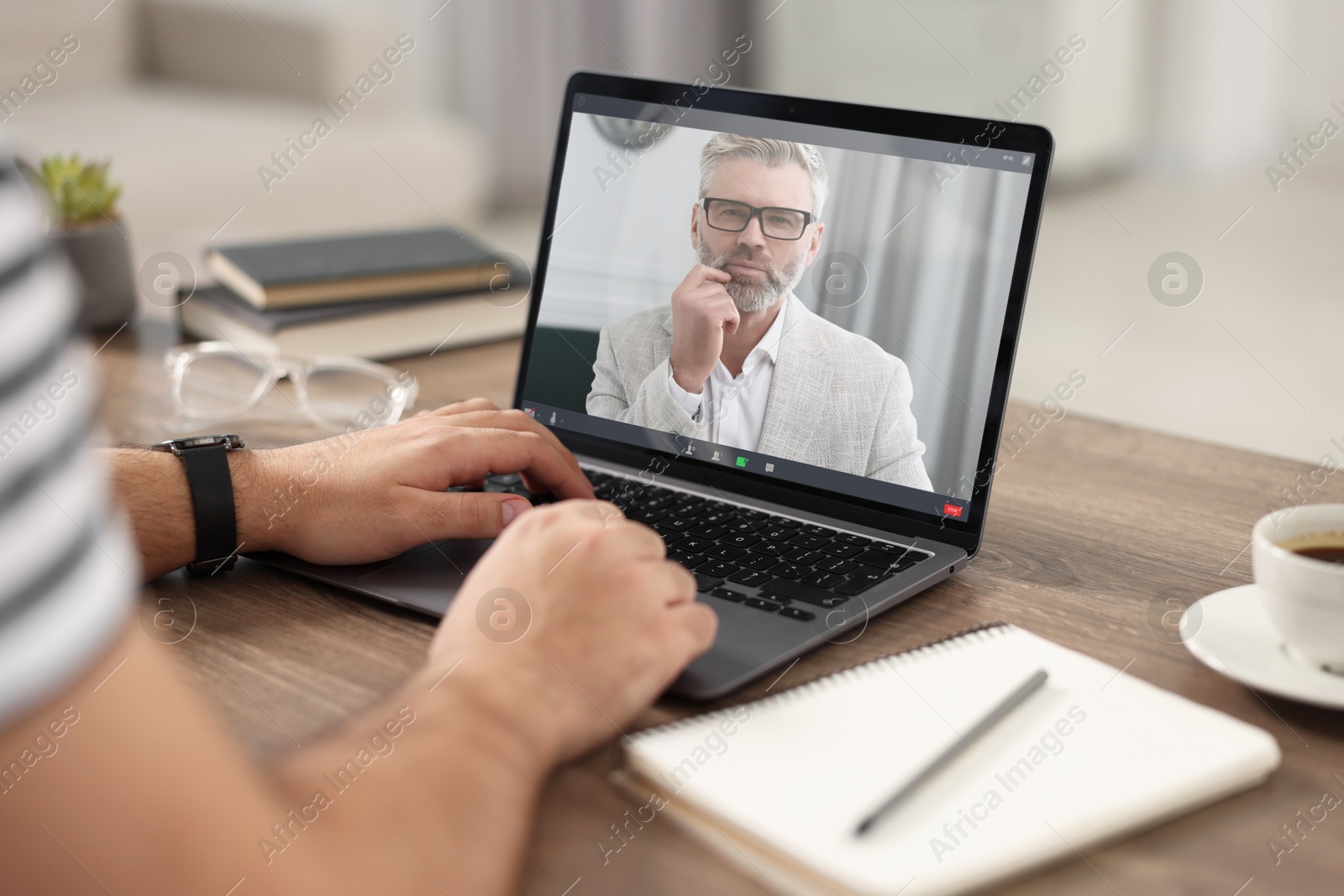 Man having video chat with psychologist via laptop at home, closeup. Online counselling Image of Man having video chat with psychologist via laptop at home, closeup. Online counselling