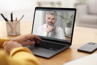 Image of Man having video chat with psychologist via laptop at home, closeup. Online counselling