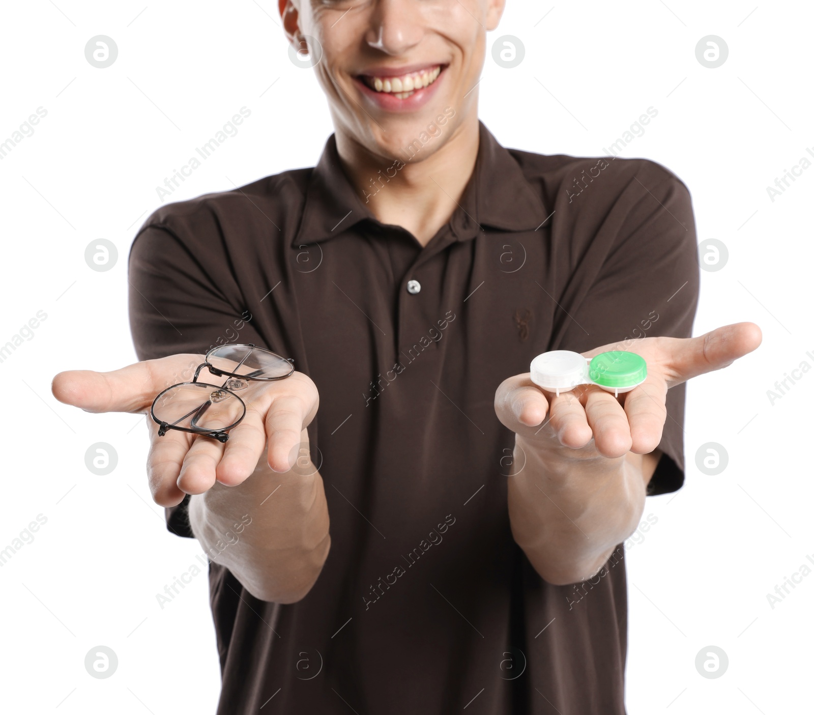 Man choosing between glasses and contact lenses on white background, closeup Photo of Man choosing between glasses and contact lenses on white background, closeup
