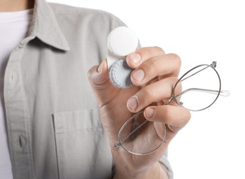 Photo of Man with glasses and contact lenses on white background, closeup