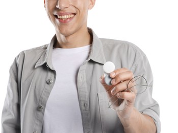 Photo of Man with glasses and contact lenses on white background, closeup