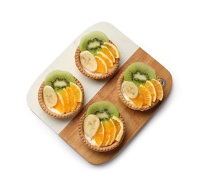 Photo of Tartlets with fruits isolated on white, top view. Delicious dessert