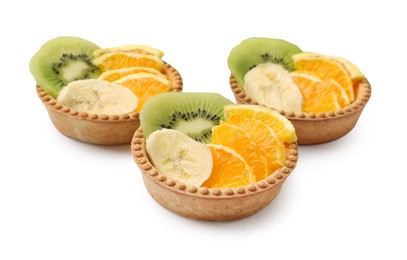 Photo of Tartlets with fruits isolated on white. Delicious dessert