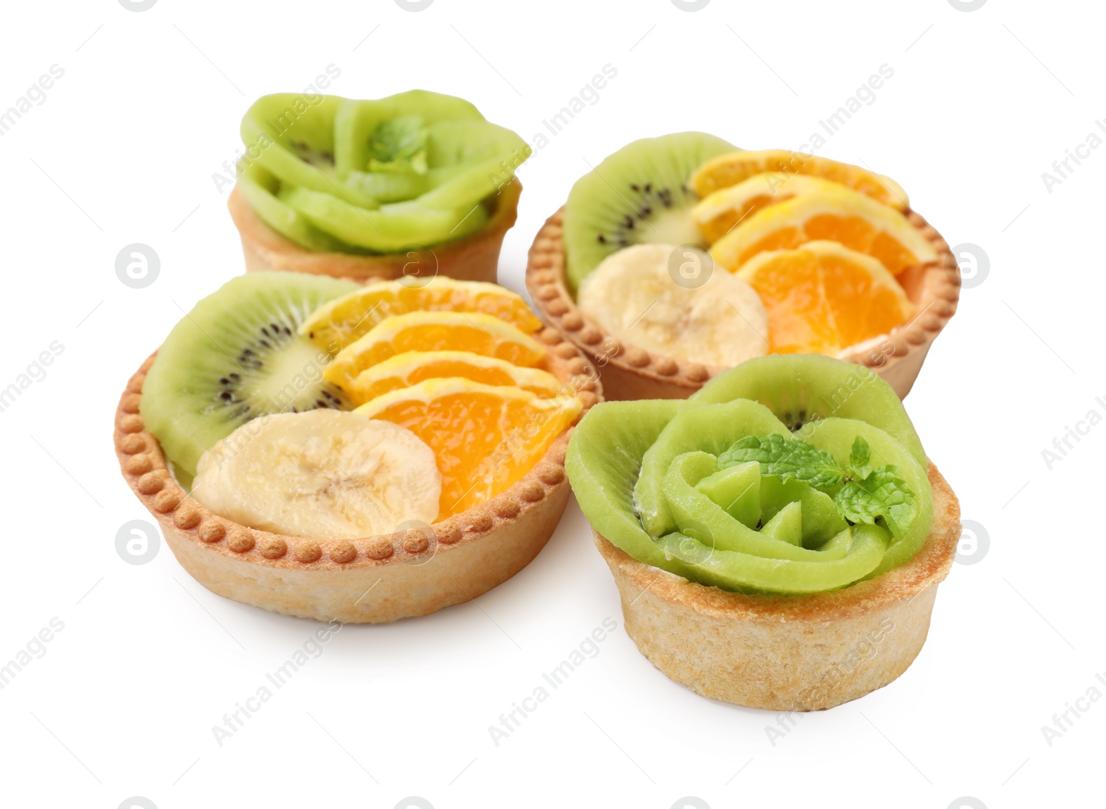 Tartlets with fruits isolated on white. Delicious dessert Photo of Tartlets with fruits isolated on white. Delicious dessert