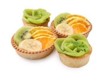 Photo of Tartlets with fruits isolated on white. Delicious dessert